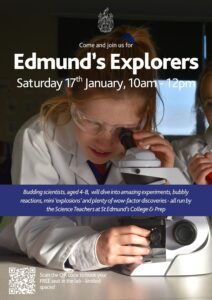 a young child wearing a white lab coat and eye protection glasses uses science equipment 